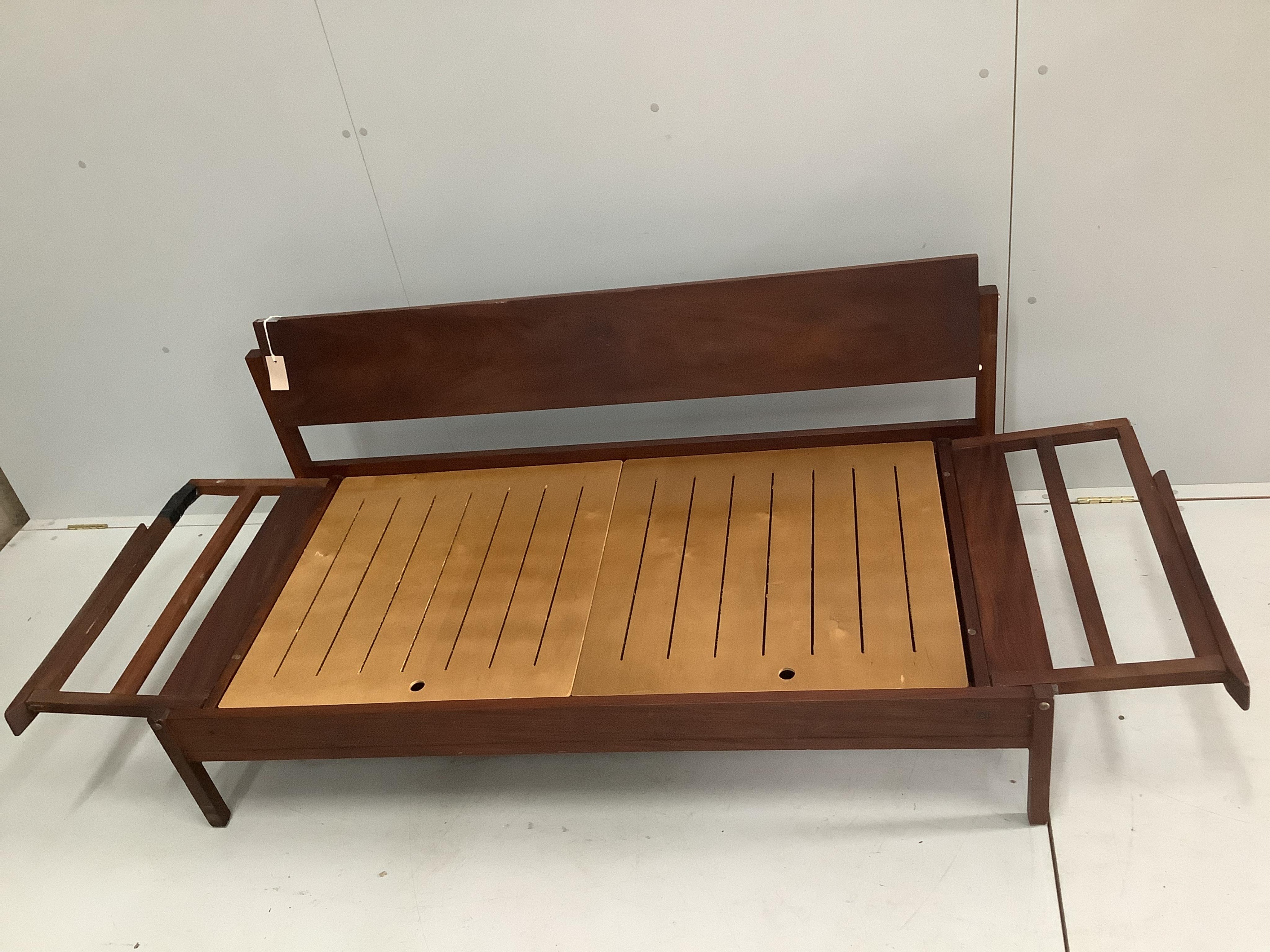 A mid century Robin Day style teak sofa bed, width 149cm, depth 72cm, height 68cm. Condition - poor